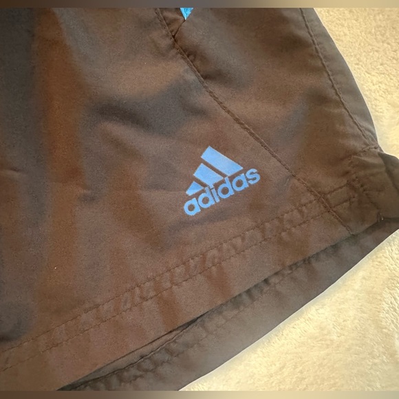 Adidas women’s medium running shorts. Black with 3 stripe in blue. EUC - Picture 2 of 7